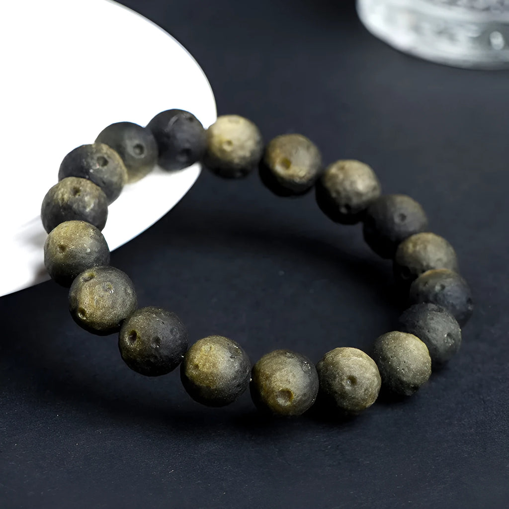 Natural obsidian crater ball bracelet with textured beads in silver or gold meteorite finish
