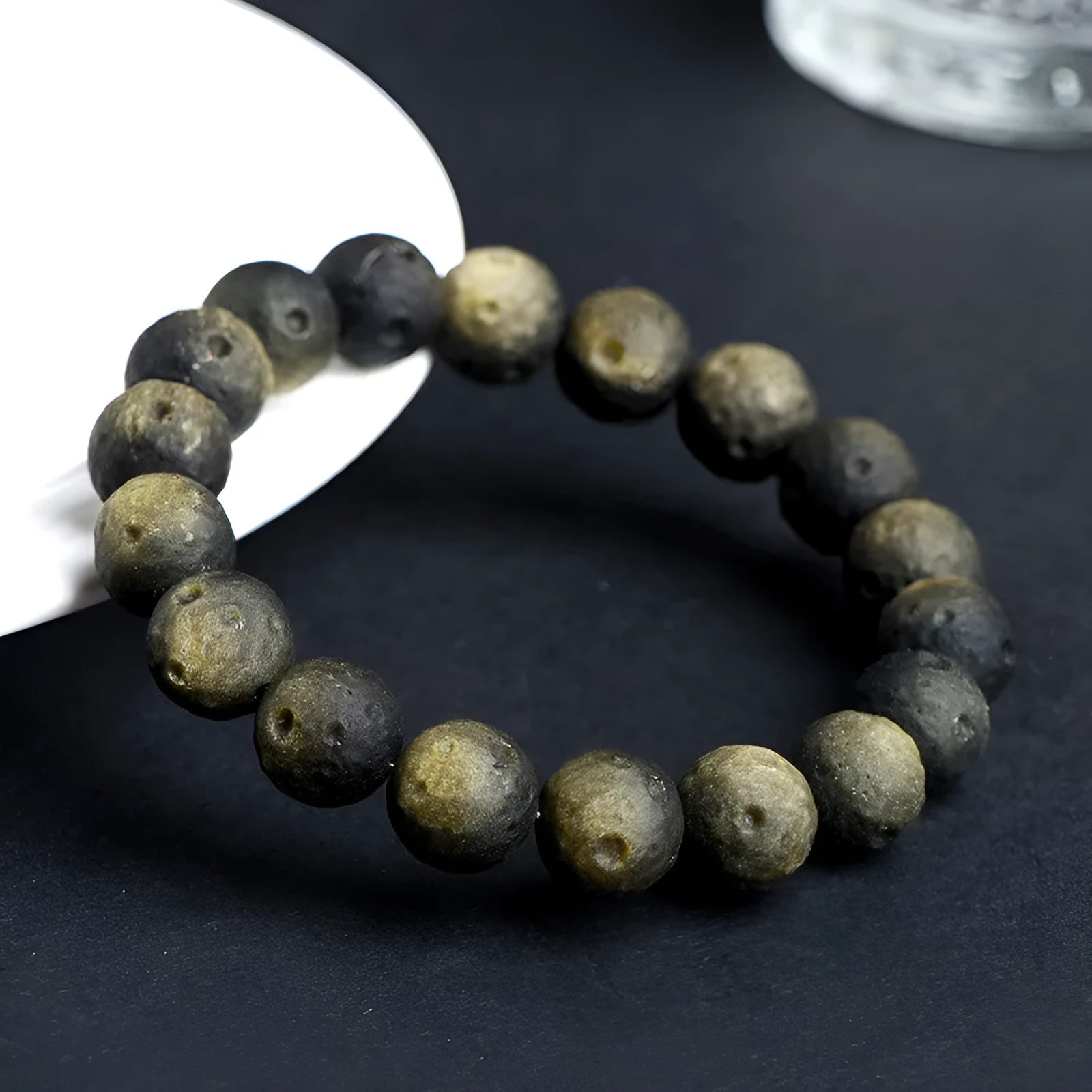 Natural obsidian crater ball bracelet with textured beads in silver or gold meteorite finish
