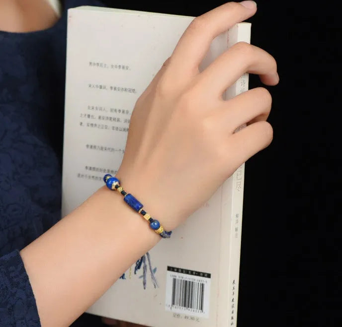 Hand-woven ethnic watch bracelet in flexible wire, showing Hongfei Ebony and Lapis Lazuli colour options.