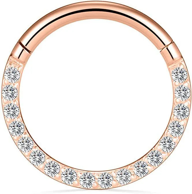 A stainless steel seamless nose ring with a diamond setting, shown in gold, rose gold, black, and steel finishes.