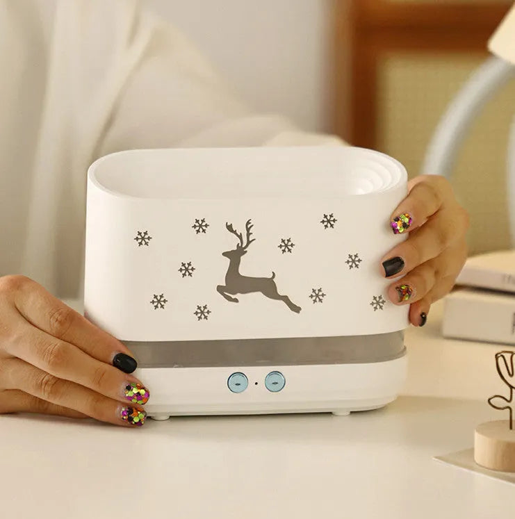 White round Elk flame effect humidifier diffuser with mist and LED light on a surface.
