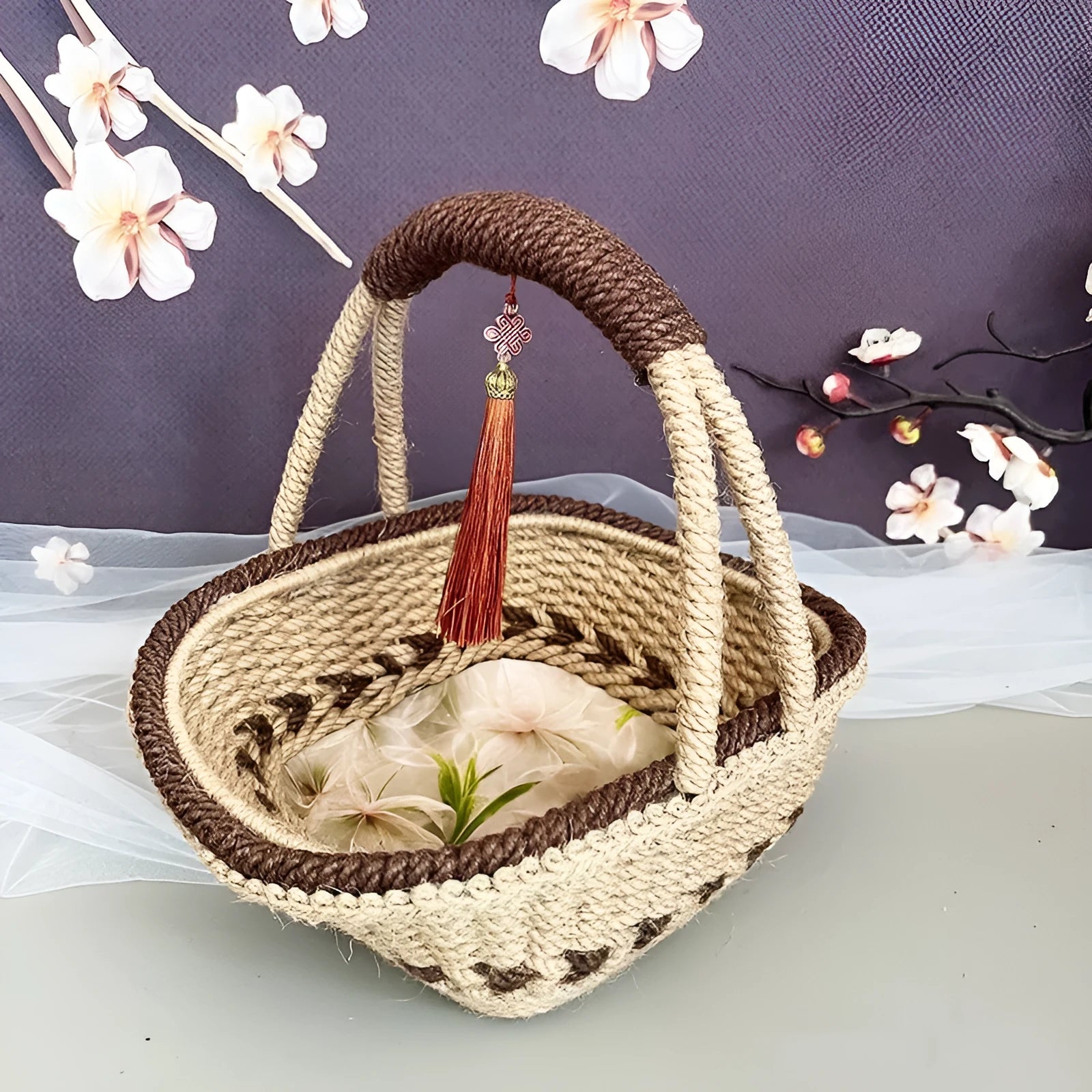 Hand-woven straw basket with hemp rope detailing in rustic coffee brown colour