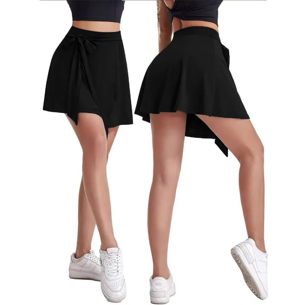 Black unisex thigh-length sports skirt culottes with built-in shorts and high waist design.