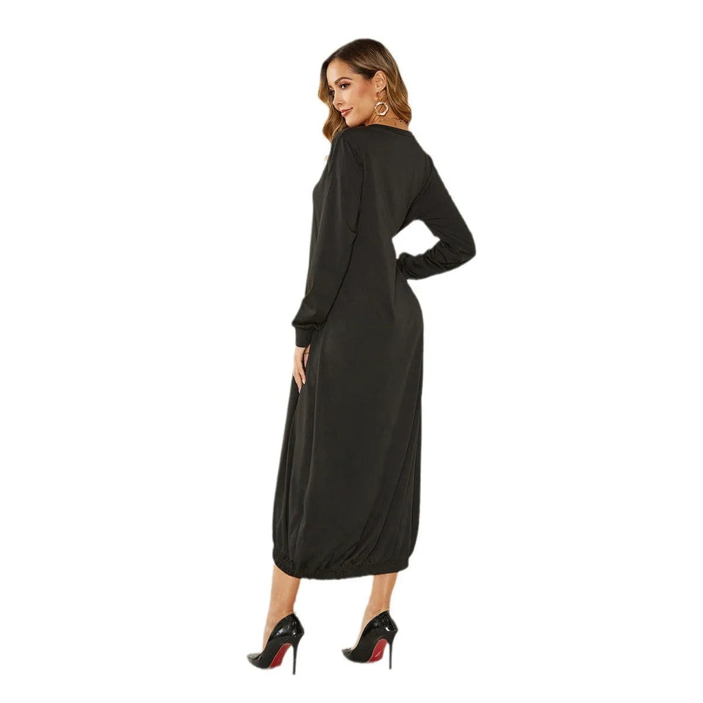 A loose black lantern dress with a lace-up crew neck, showcasing its casual knitted pullover style.