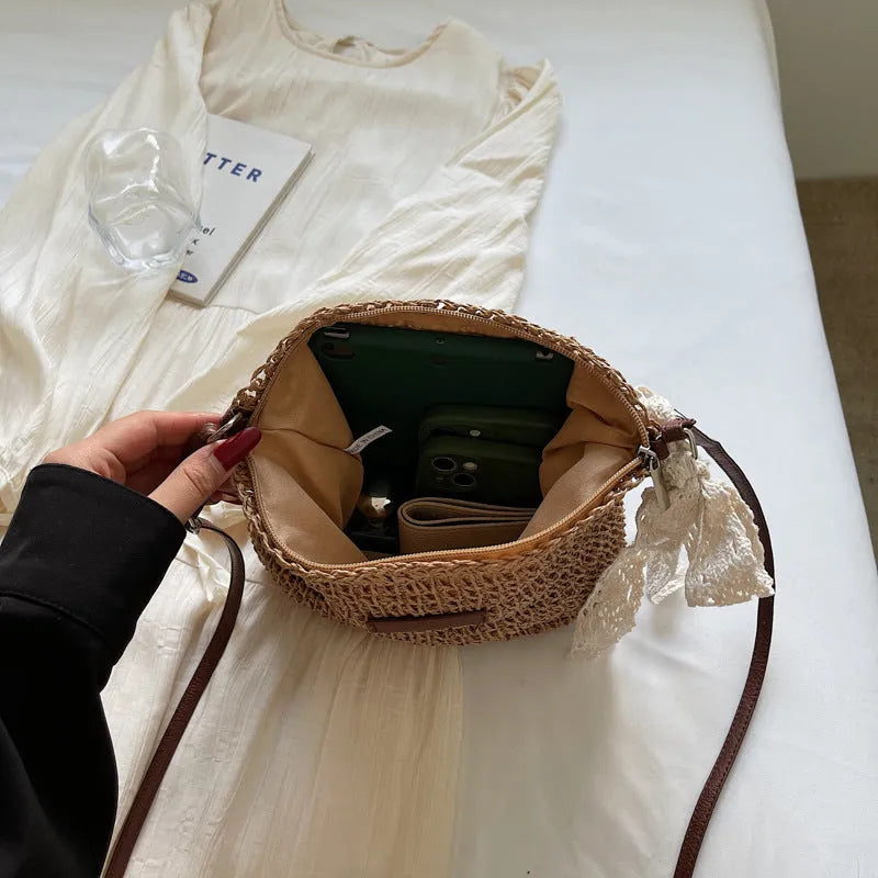 Women's woven straw messenger bag with hollowed design in khaki colour