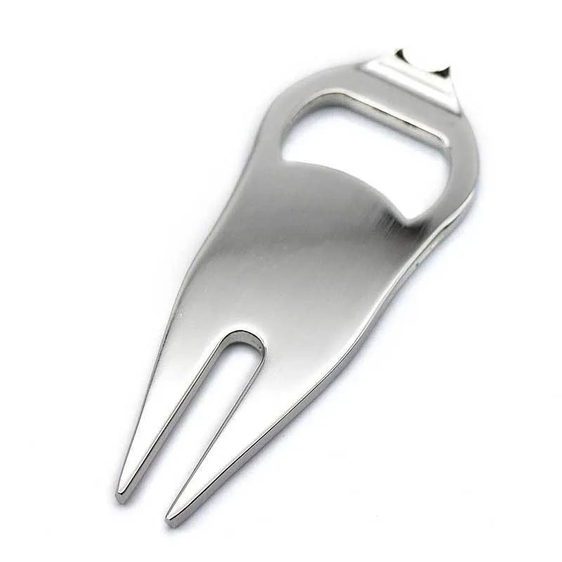 Black zinc alloy golf ball yoke bottle opener tool on a putting green.
