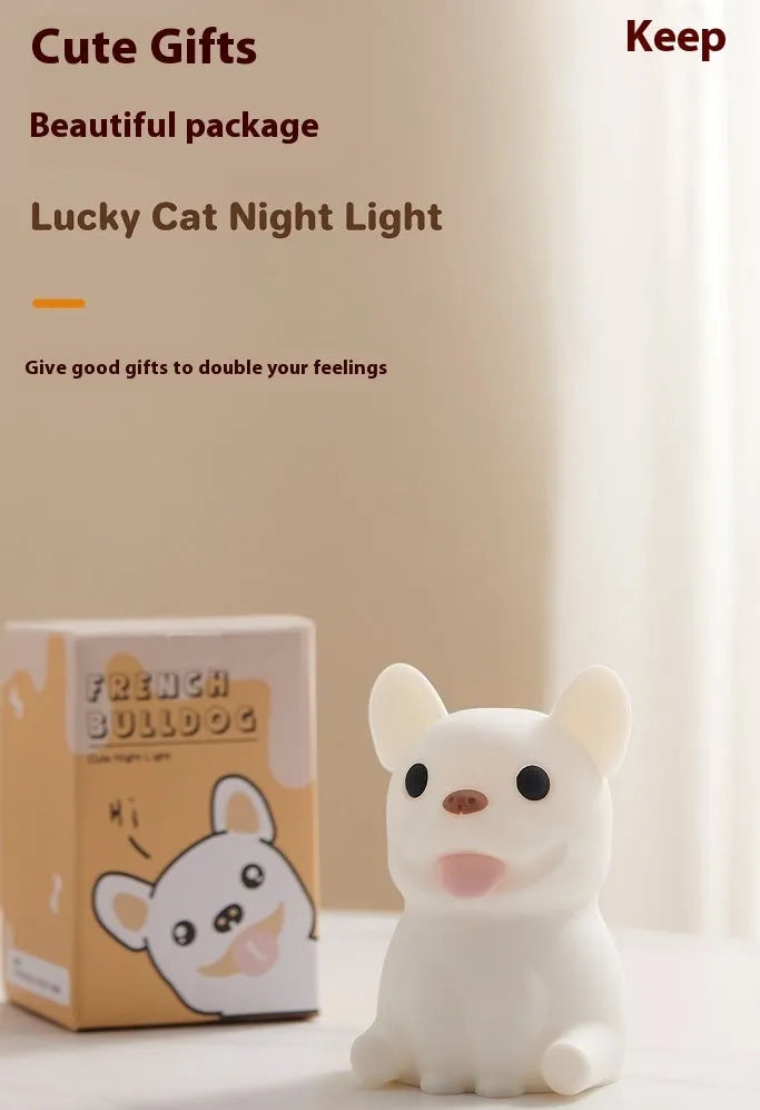 Cartoon animal silicone USB night light with dimmer switch on a bedside table.