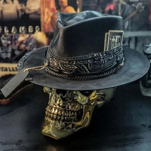 Handmade wool felt skull hat with a conical crown and blue denim trim.