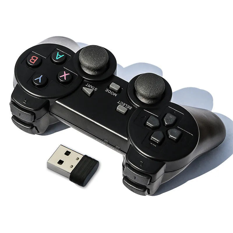 Classic black wireless 2.4G gamepad with USB receiver on a dark surface.