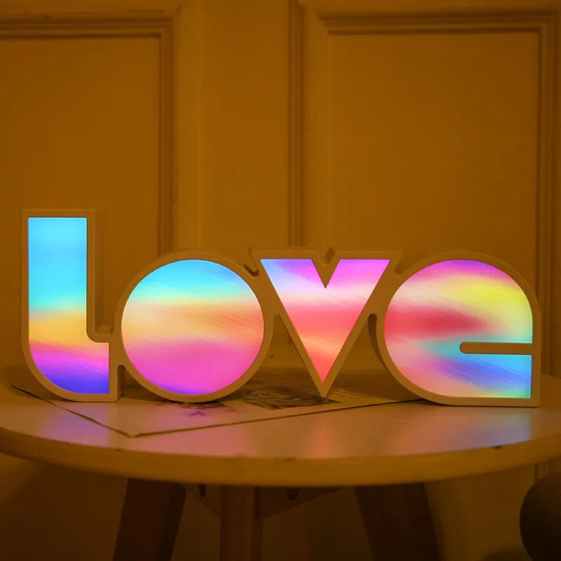 Rainbow-colour plastic LED LOVE light decoration measuring 35.5cm tall with 'LOVE' lettering