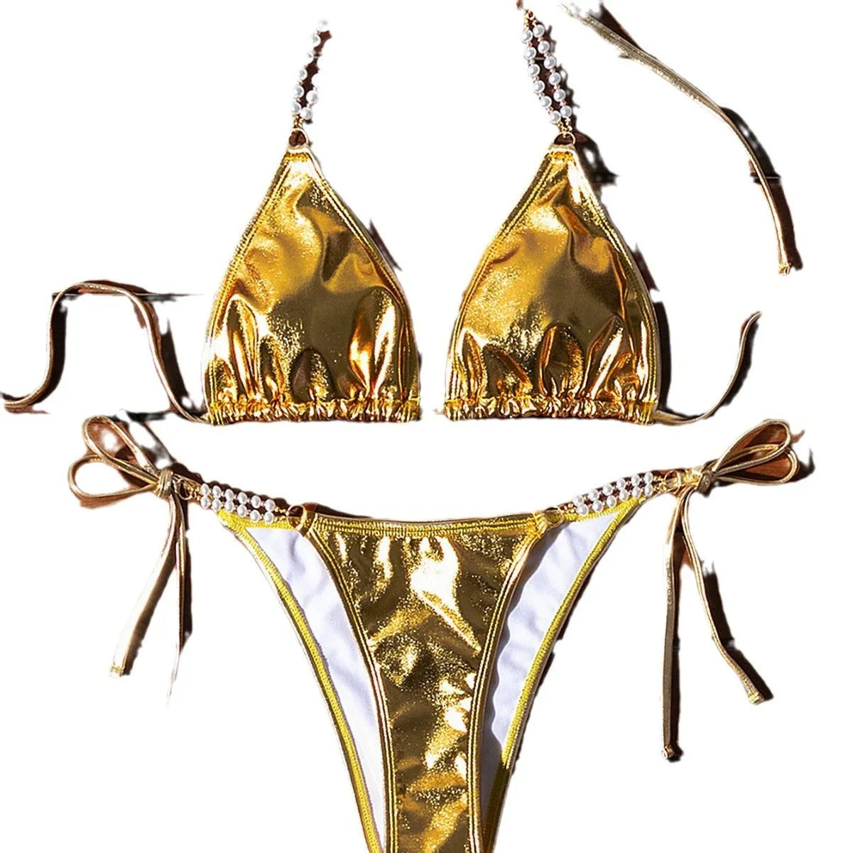 Gold bronzing effect women's halter neck bikini with lace-up back and pearl chain detail on mannequin