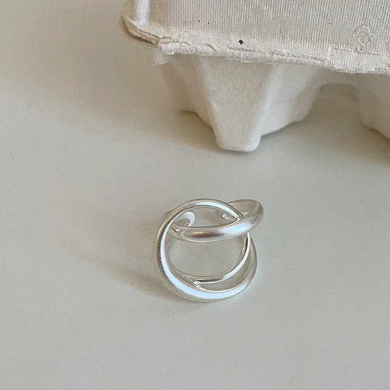 Three-dimensional interlaced matte metal open ring with geometric design in gold or silver electroplated finish