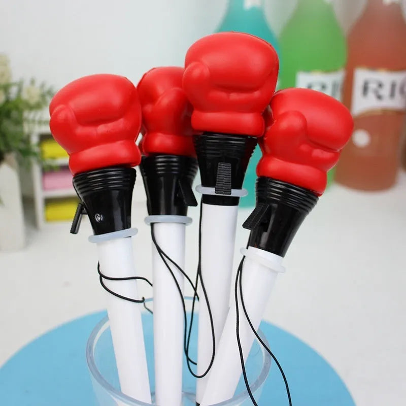 Four black gel pens with pressure relief boxing press ejection mechanisms