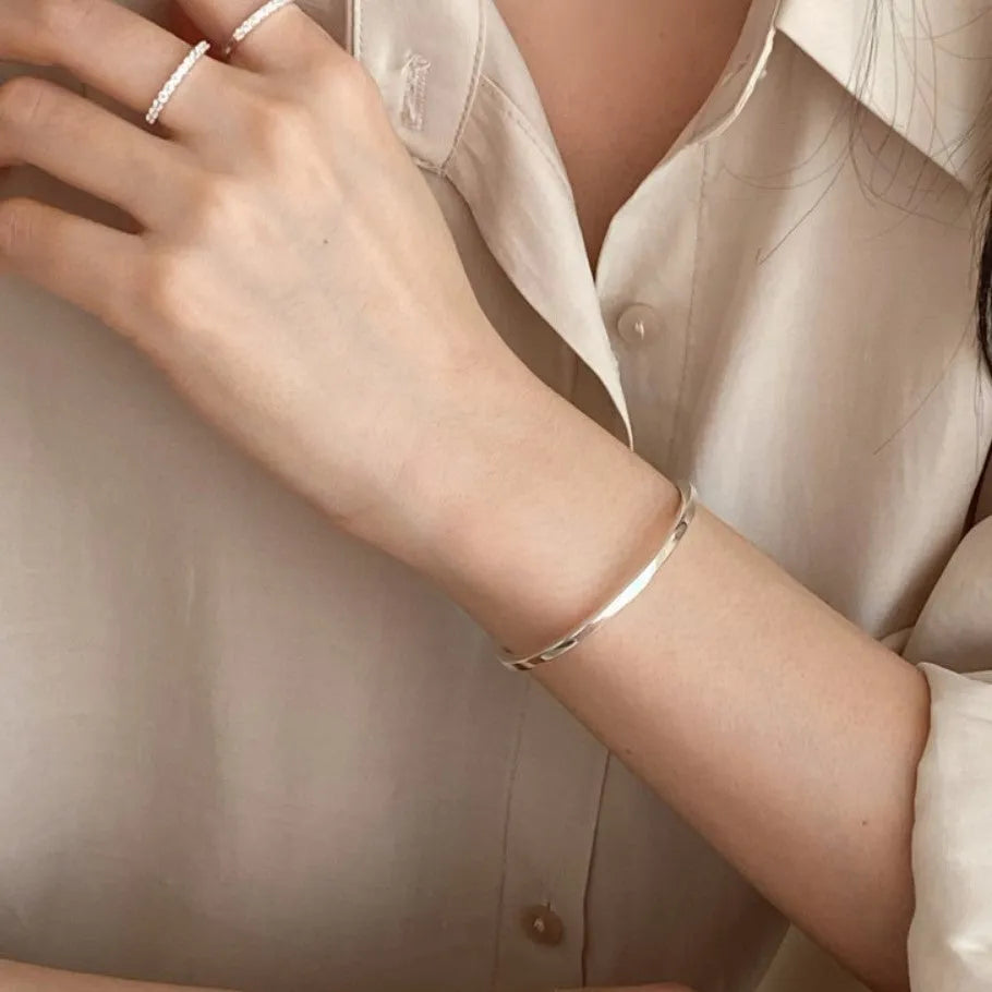 Sterling silver 3mm square line bracelet with electroplated finish on white background
