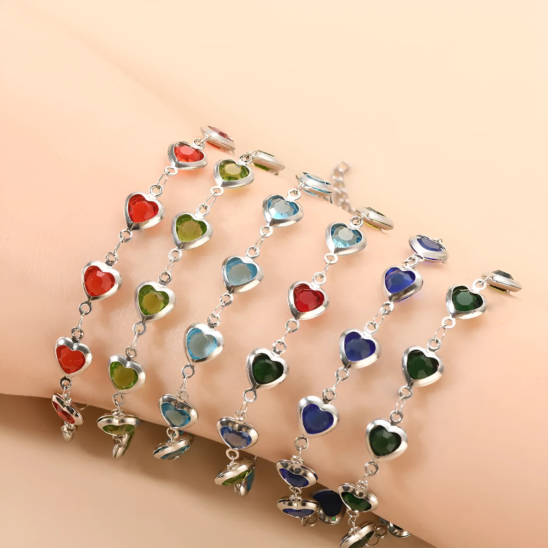 Geometric stainless steel heart bracelet showing six electroplated colour options on white background