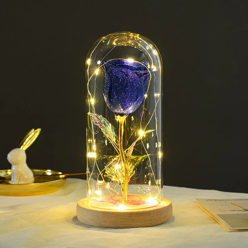 Handmade eternal red rose flower with warm white LED light inside a glass cover