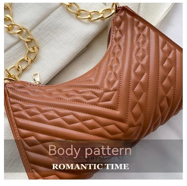 A women's black pleated chain baguette shoulder bag with a vertical square shape and an adjustable strap.