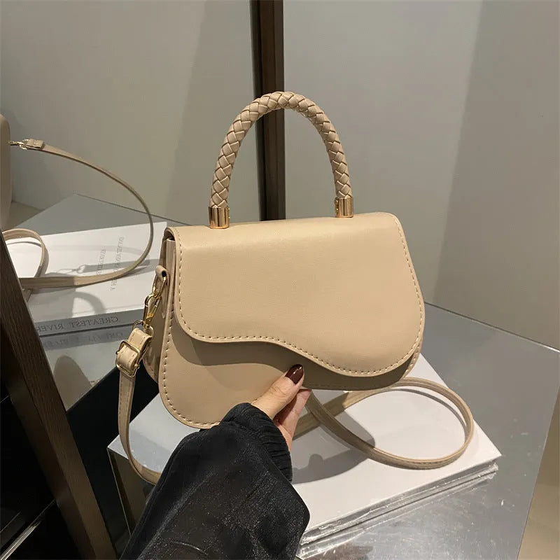 Soft PU one-shoulder bag with magnetic snap, horizontal square shape, shown in khaki with optional pendant.