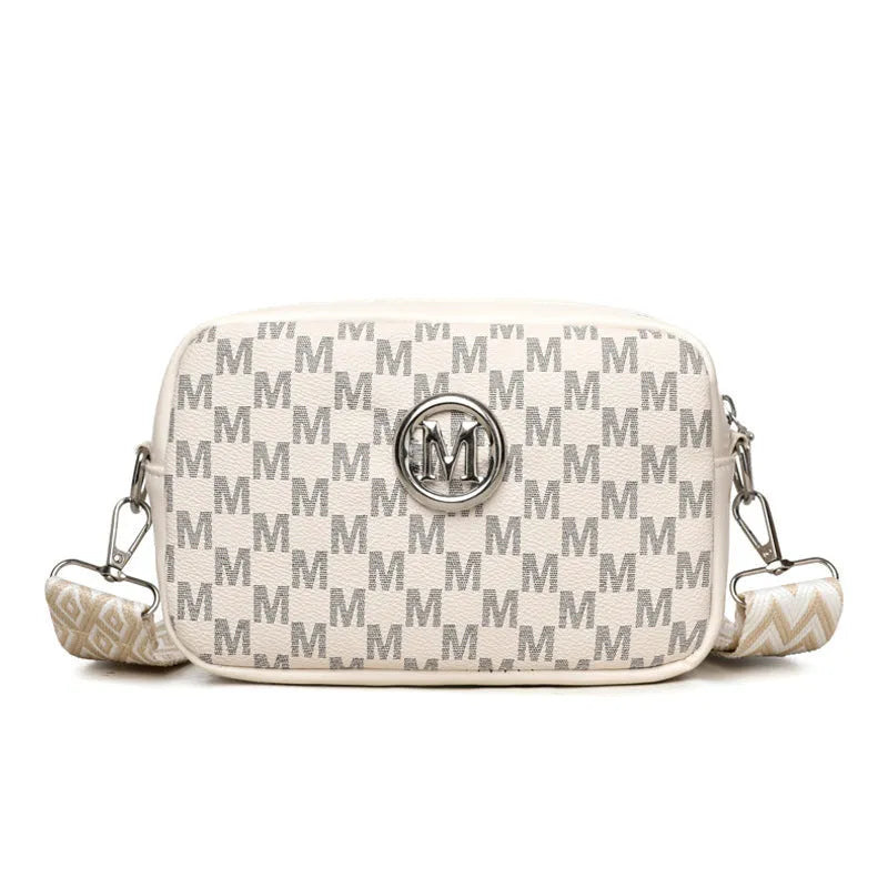 Crossbody bag with wide shoulder strap in black colour showing three-dimensional pocket construction