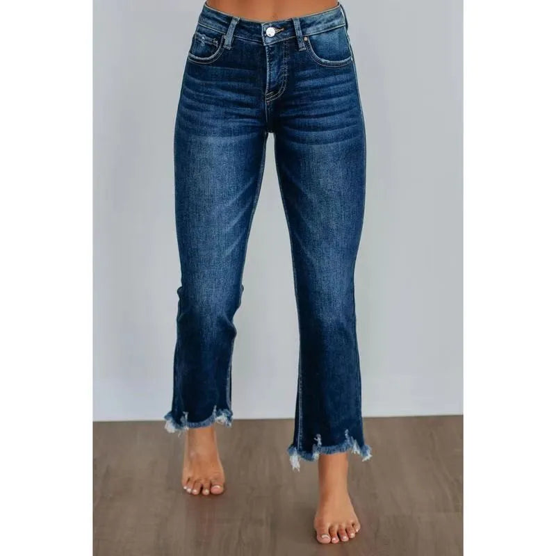 Women's solid colour denim trousers with hand-distressed detailing in dark blue wash