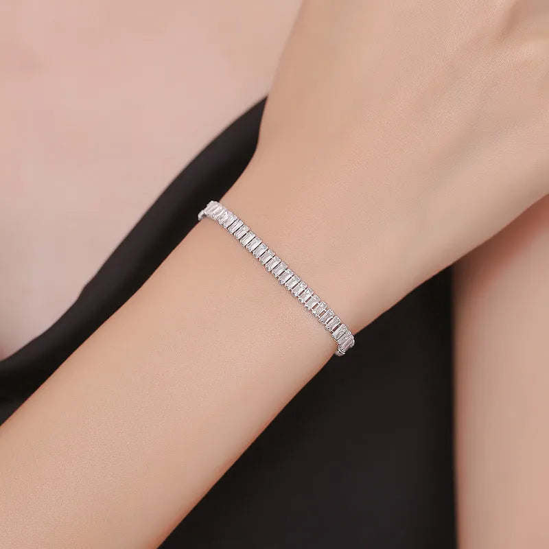 Women's geometric brass bracelet with zircon stones in rectangular design