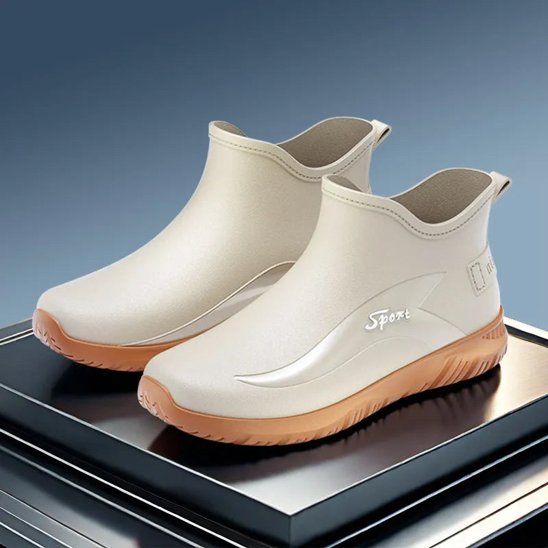 Men's short PVC wellington boots in beige and black colours with a flat non-slip sole.