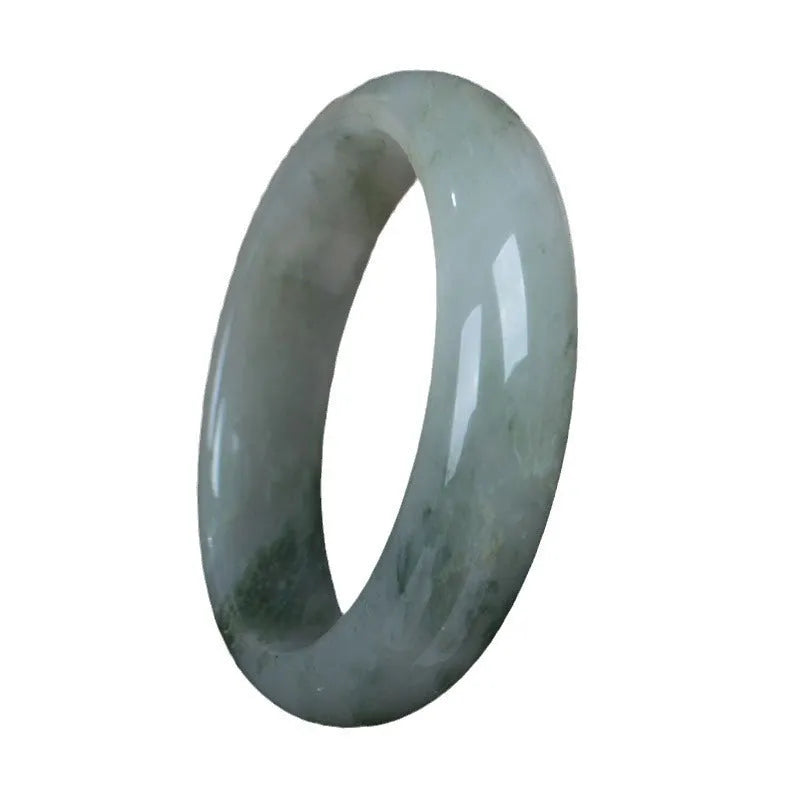 Natural Tianshan Jinsi Jade Chinese style bracelet showing circular form on a plain background.