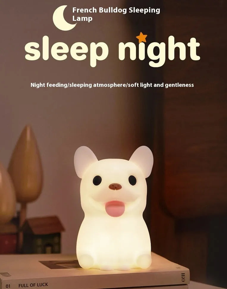 Cartoon animal silicone USB night light with dimmer switch on a bedside table.