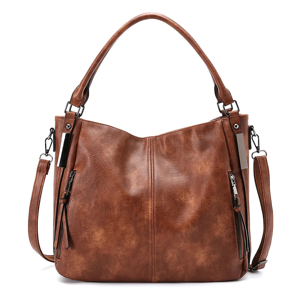Soft PU crossbody shoulder bag in khaki with metal accent and double strap connectors on a white background