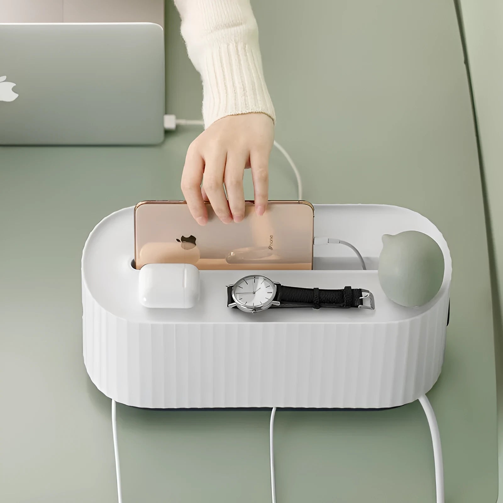 Blue and white plastic cable management box for power strips with lid open showing phone slot and cable holes