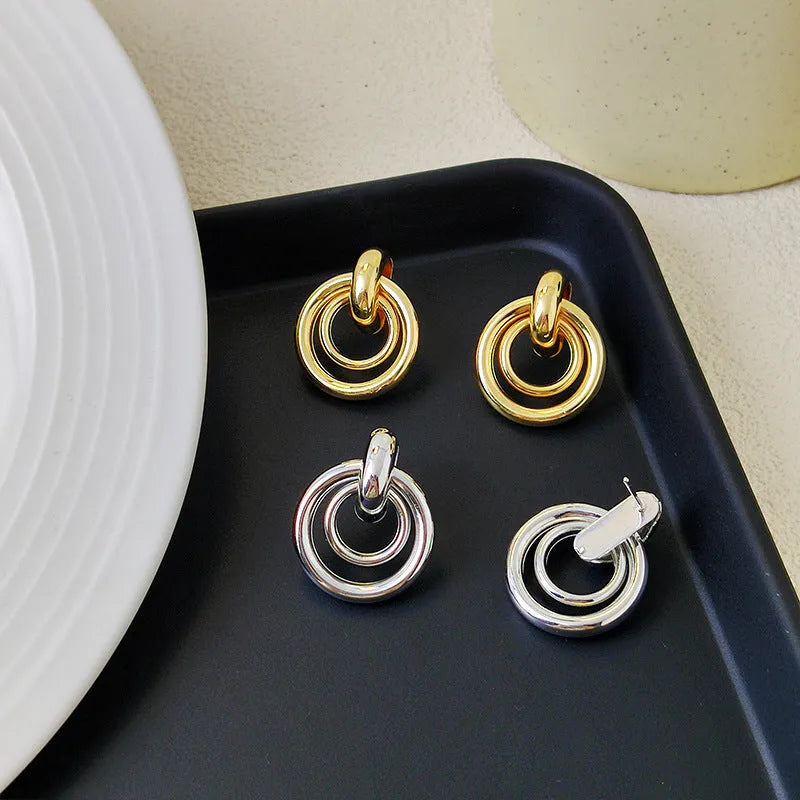 Geometric round ring earrings for women with electroplated gold or silver finishes and irregular contemporary design