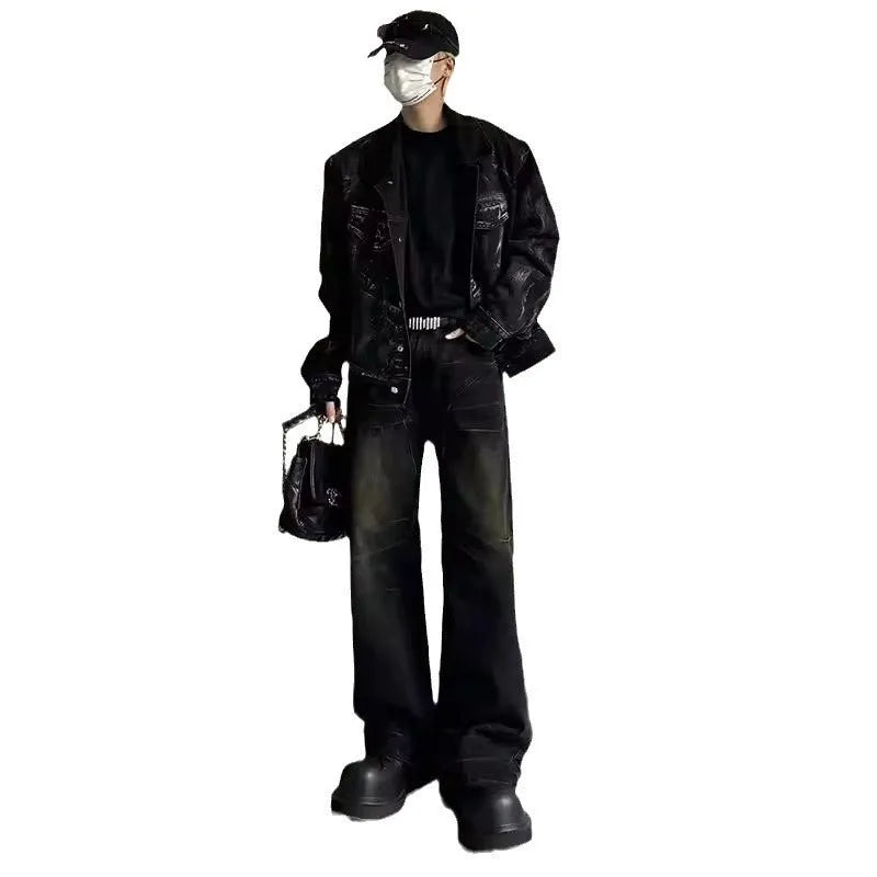 Mens washed black straight leg denim jeans with dirty mud texture and zip fly