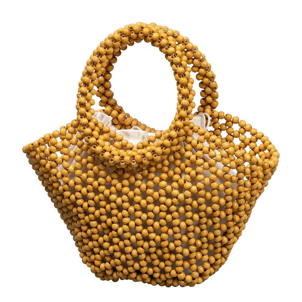 Hand-woven maple wood beach bag with wooden bead decoration in dumpling shape
