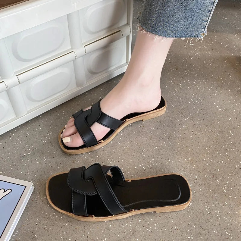 Women's PVC cross-strap toe ring sandals in light blue on a white background.