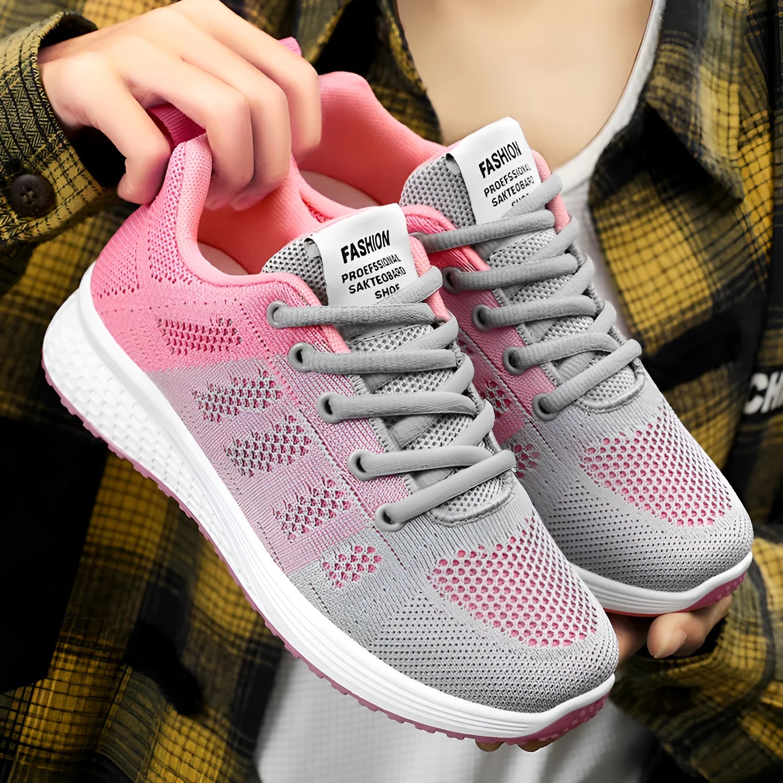 Women's Flyknit running shoe in black, rose red, or gray pink with soft sole and flat heel.