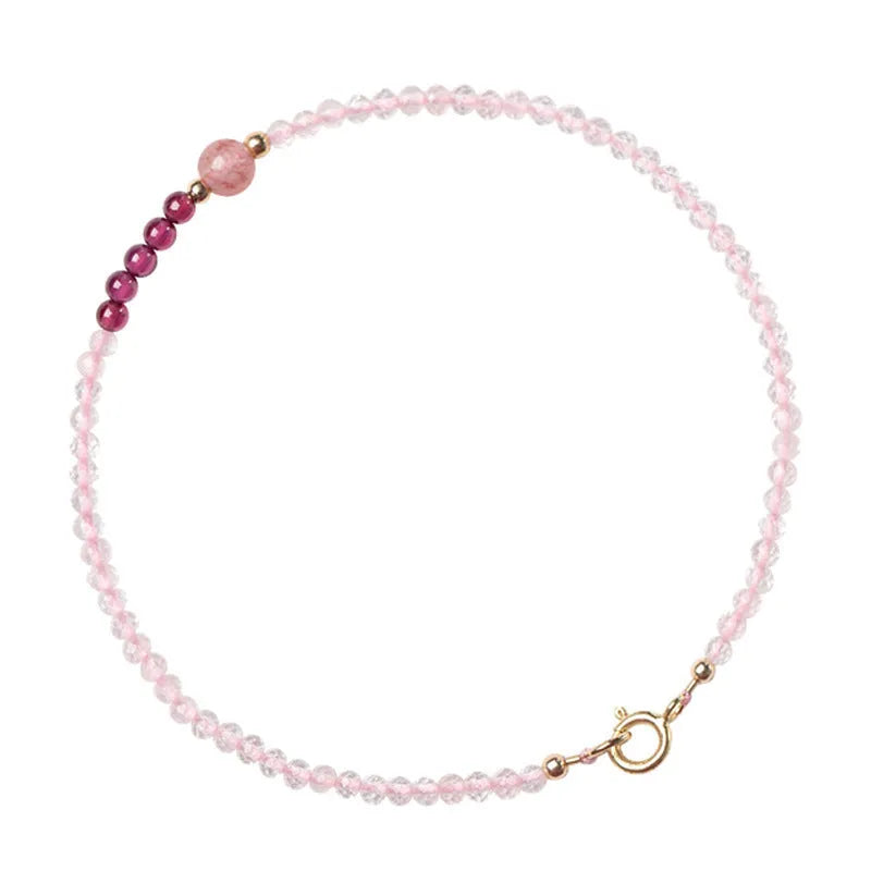Handmade pink crystal bracelet with strawberry quartz beads and animal zodiac design