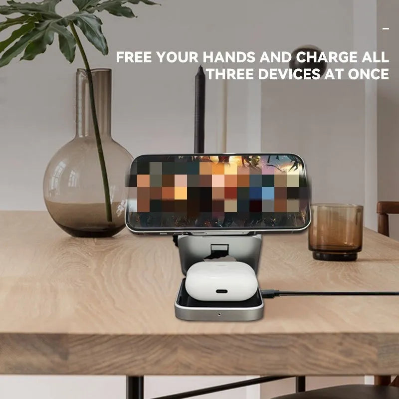 Folding three-in-one desktop wireless charging bracket with magnetic ring on a desk.