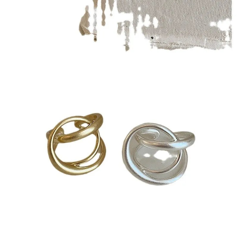 Three-dimensional interlaced matte metal open ring with geometric design in gold or silver electroplated finish