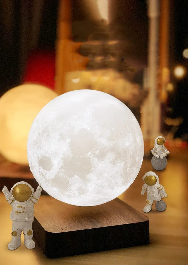 Magnetic levitation moon planet night light floating above base with astronaut decorations.