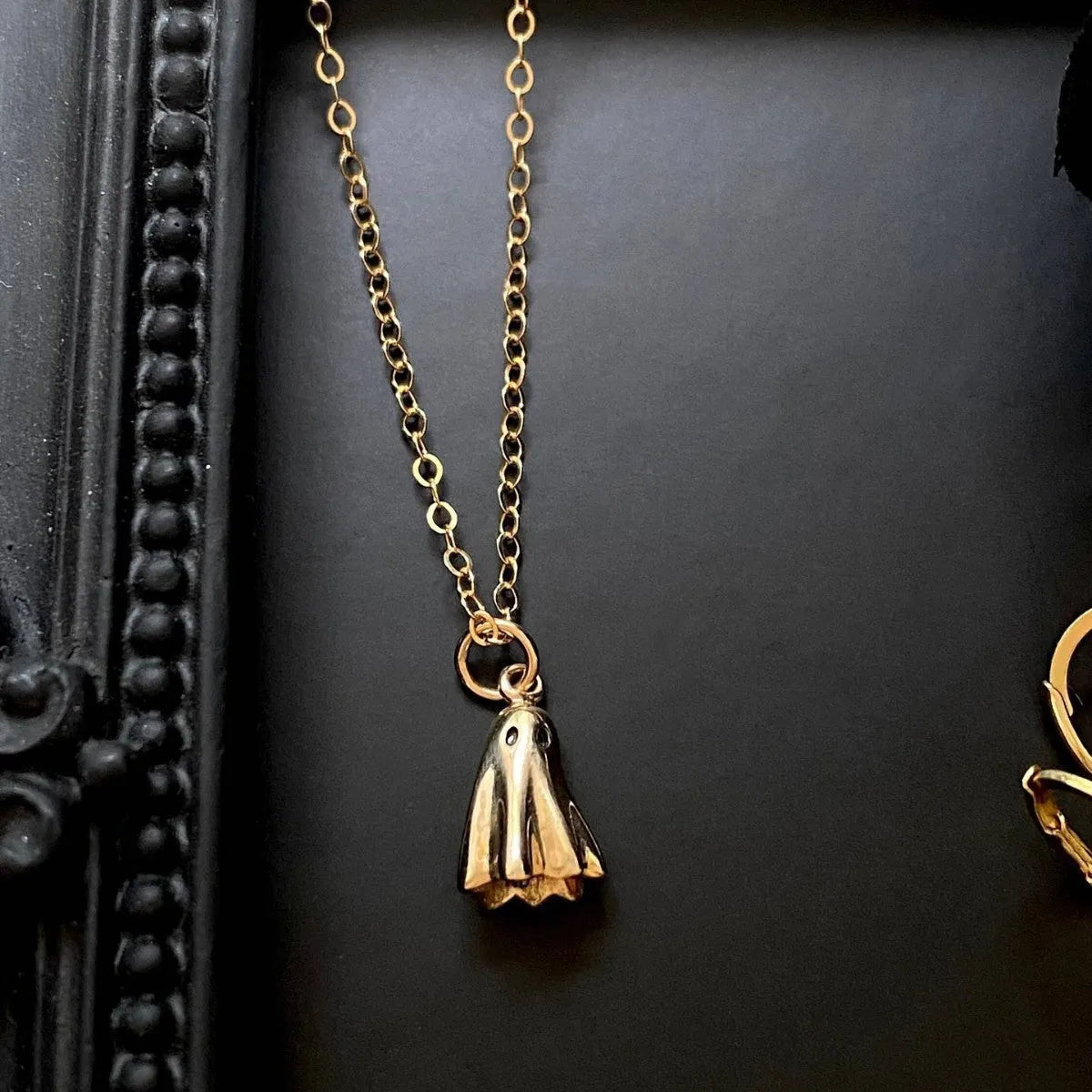 Ghost motif pendant necklace on a twisted stainless steel chain, available in Cable, Figaro, or Mini Staple chain styles.
