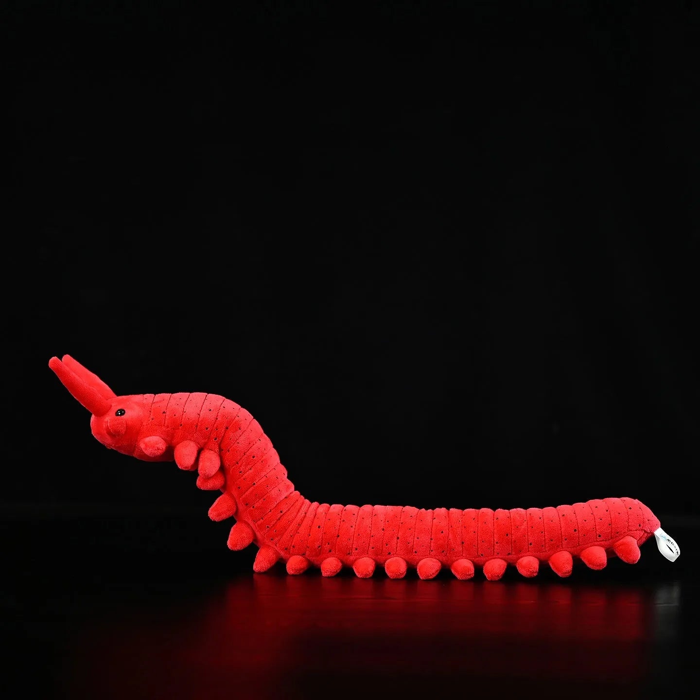 Red velvet worm plush toy silkworm doll 60cm long on a plain background