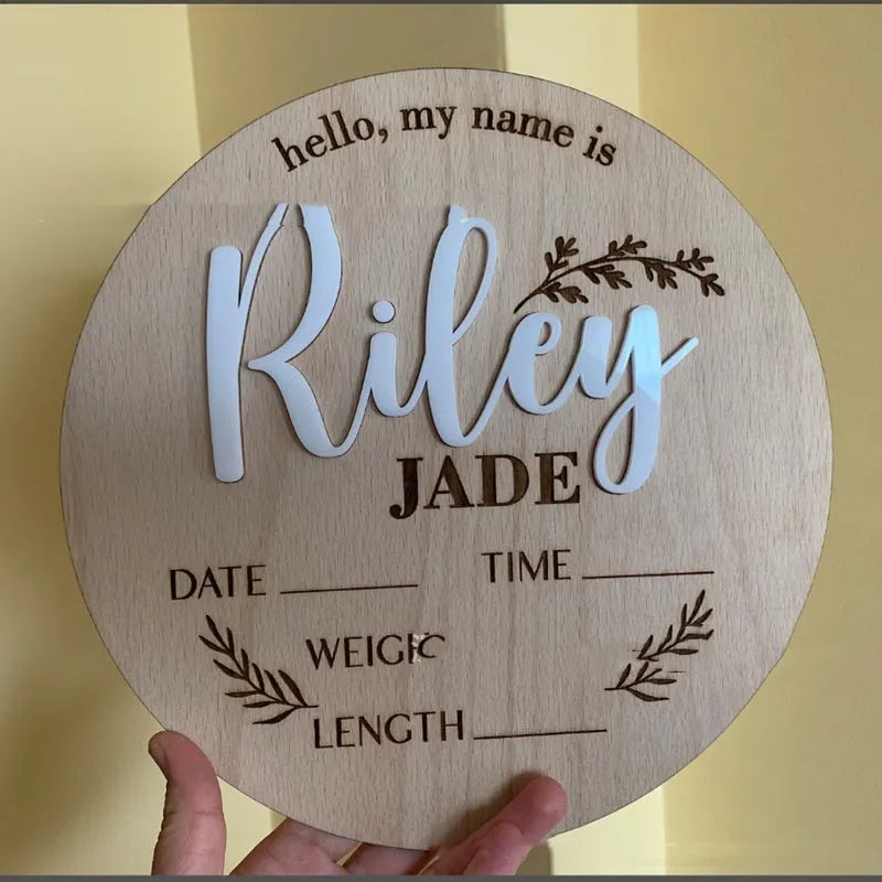Square wooden baby name label displaying birth information with 15cm dimensions
