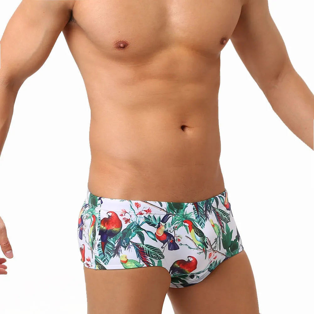 Men's swimming trunks with flower-bird print pattern in nylon fabric showing briefs style