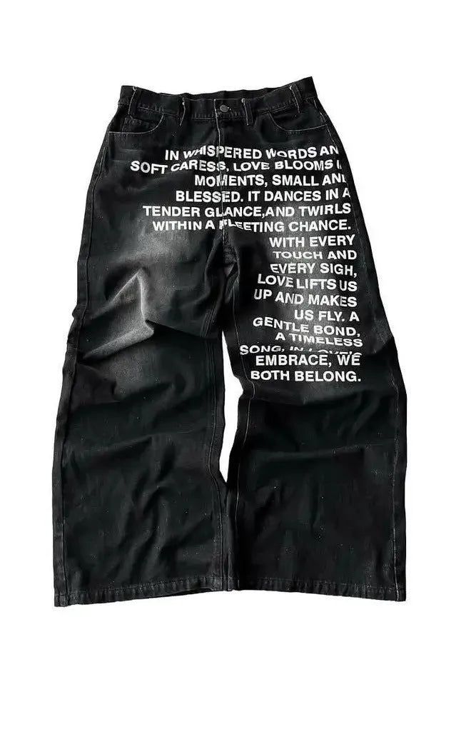 Men's black cotton wide-leg straight trousers with elastic waistband showing loose fit design