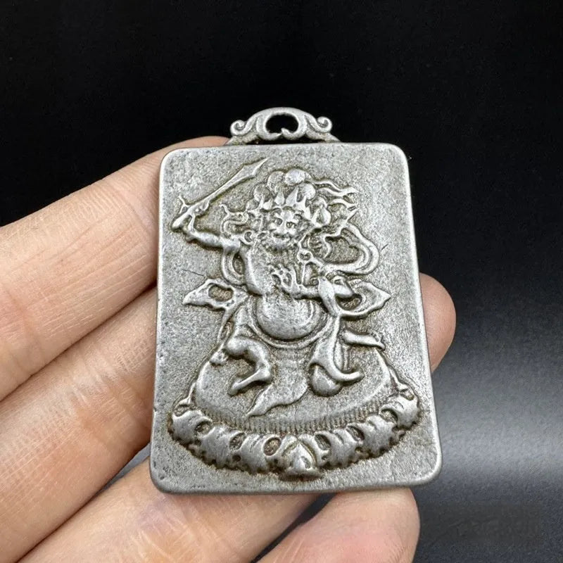 Chinese style antique iron geometrical hanging ornament pendant on a wall.