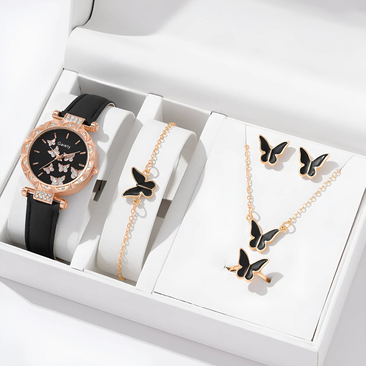Women's butterfly quartz belt watch with imitation leather strap and pin buckle, available in black brown pink red beige