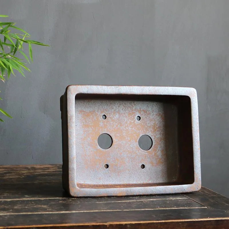 A rectangular purple sand bonsai pot with a linear firewood burning pattern, shown in two sizes.