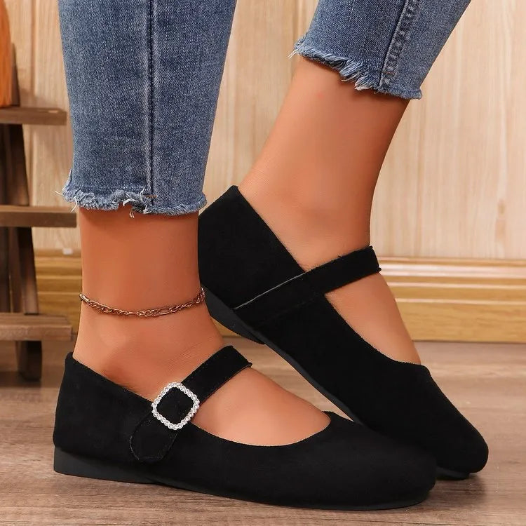 Black canvas fisherman shoes with rubber sole showing low-top design