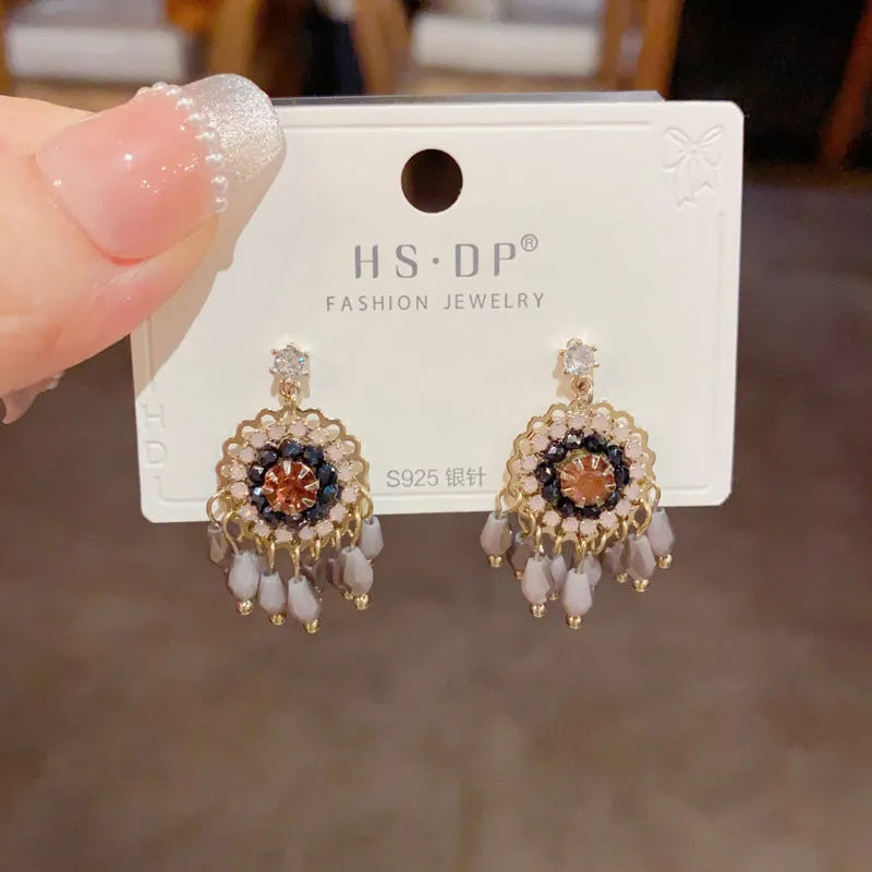 Geometric diamond-embedded crystal tassel earrings in thick gold-plated copper, purple and blue colour options