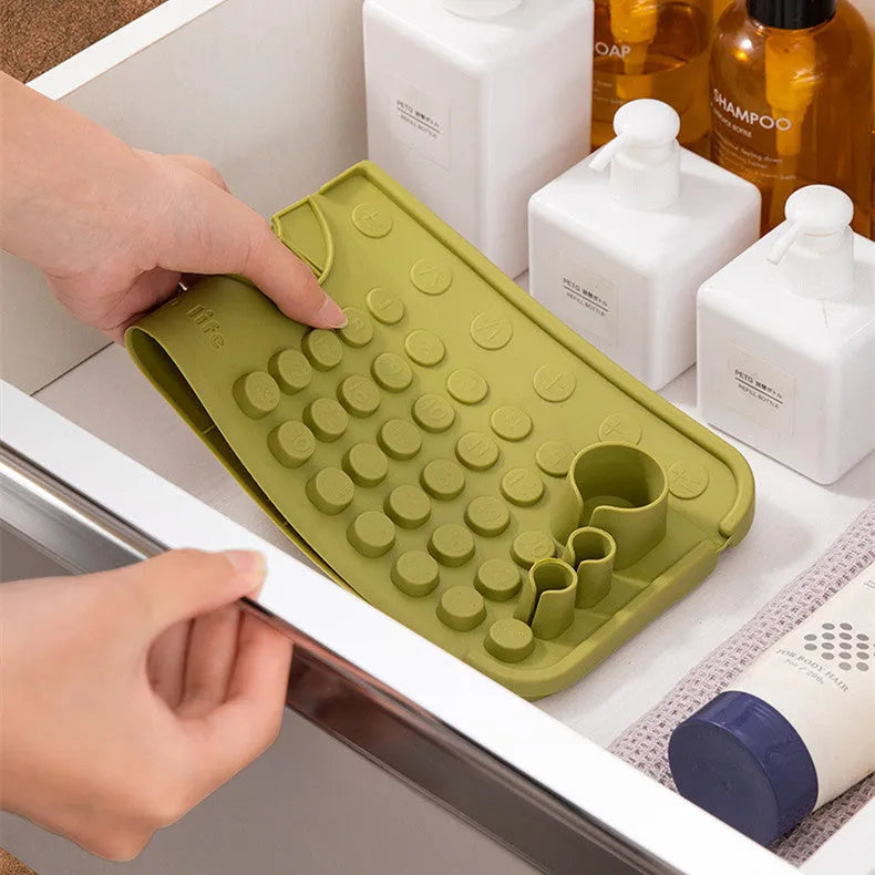 Cream TPR silicone faucet water draining pad measuring 42x14cm on a kitchen countertop